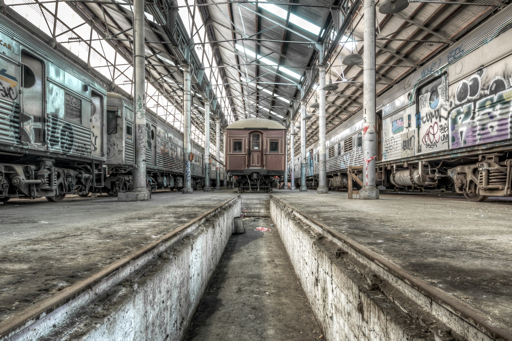 Pit at Eveleigh Paint Shop, beneath the steel and timber, this inspection pit once echoed with the steady rhythm of tools and voices as workmen toiled to keep Sydney’s railway fleet in motion.