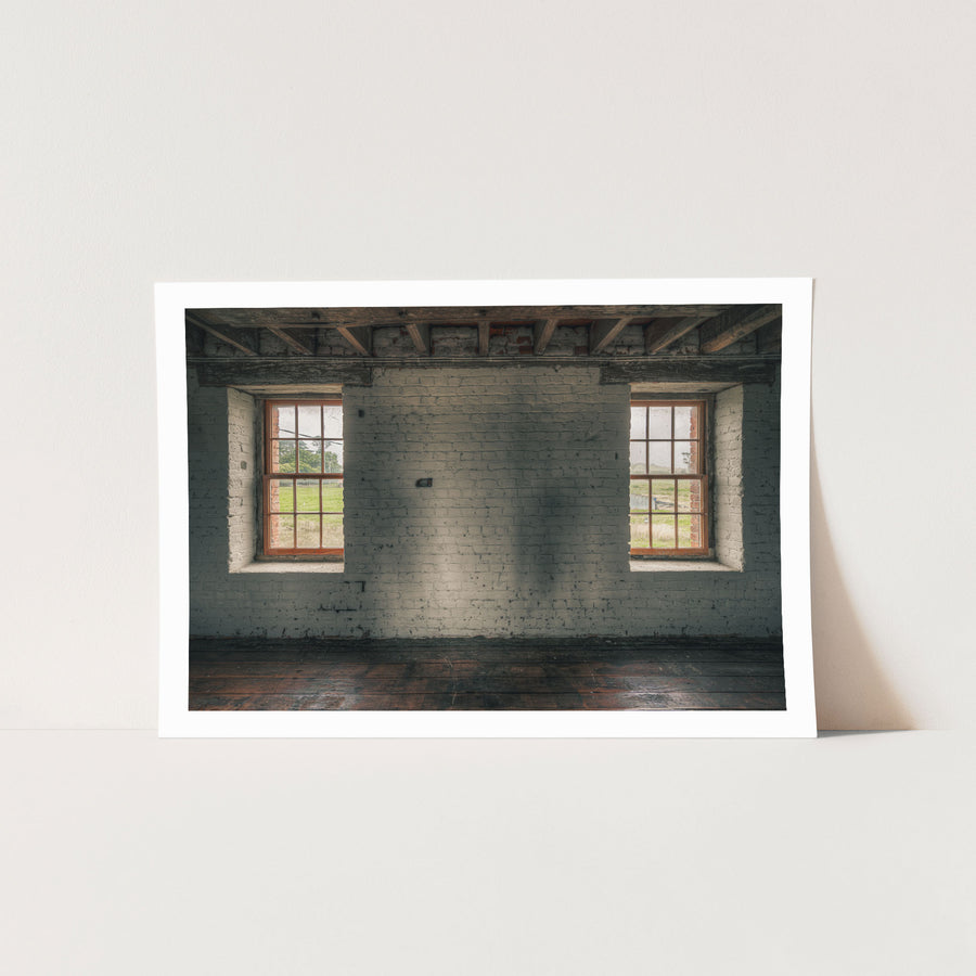 Twin timber sash windows at Jembaicumbene, whitewashed brick wall with exposed red brick reveals.