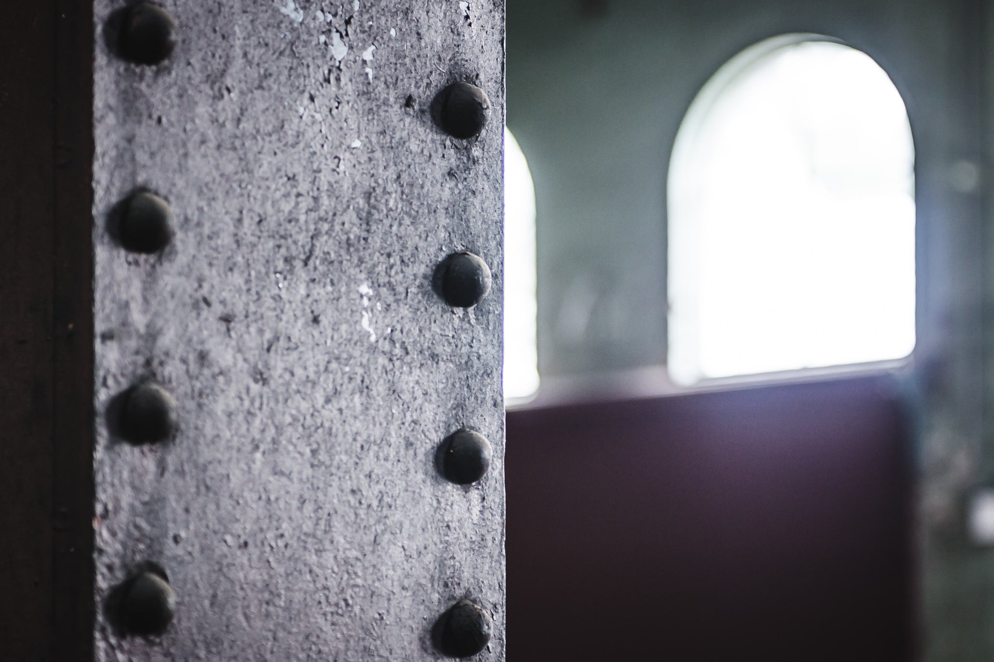 Rivets at West Ryde Pumping Station, a riveted steel column fills the left of the frame.