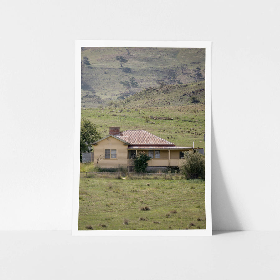 Boco Homestead at A Place to Call Home, an abandoned weatherboard farmstesd perched on a hillside.