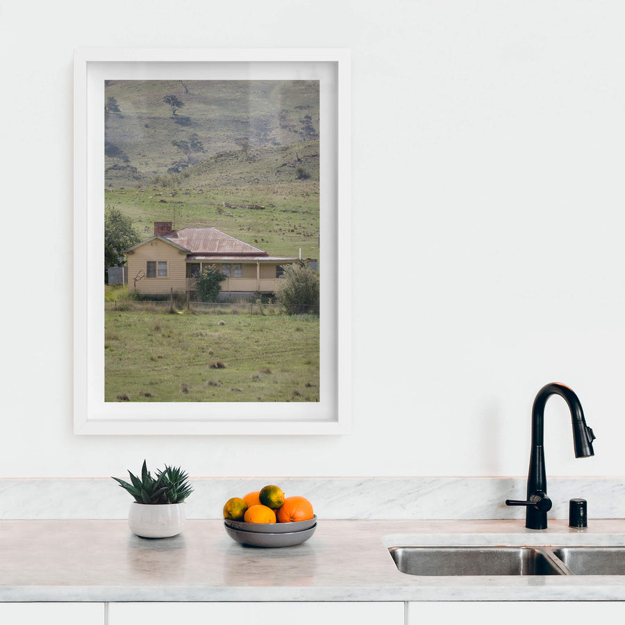 Boco Homestead at A Place to Call Home, an abandoned weatherboard farmstesd perched on a hillside.