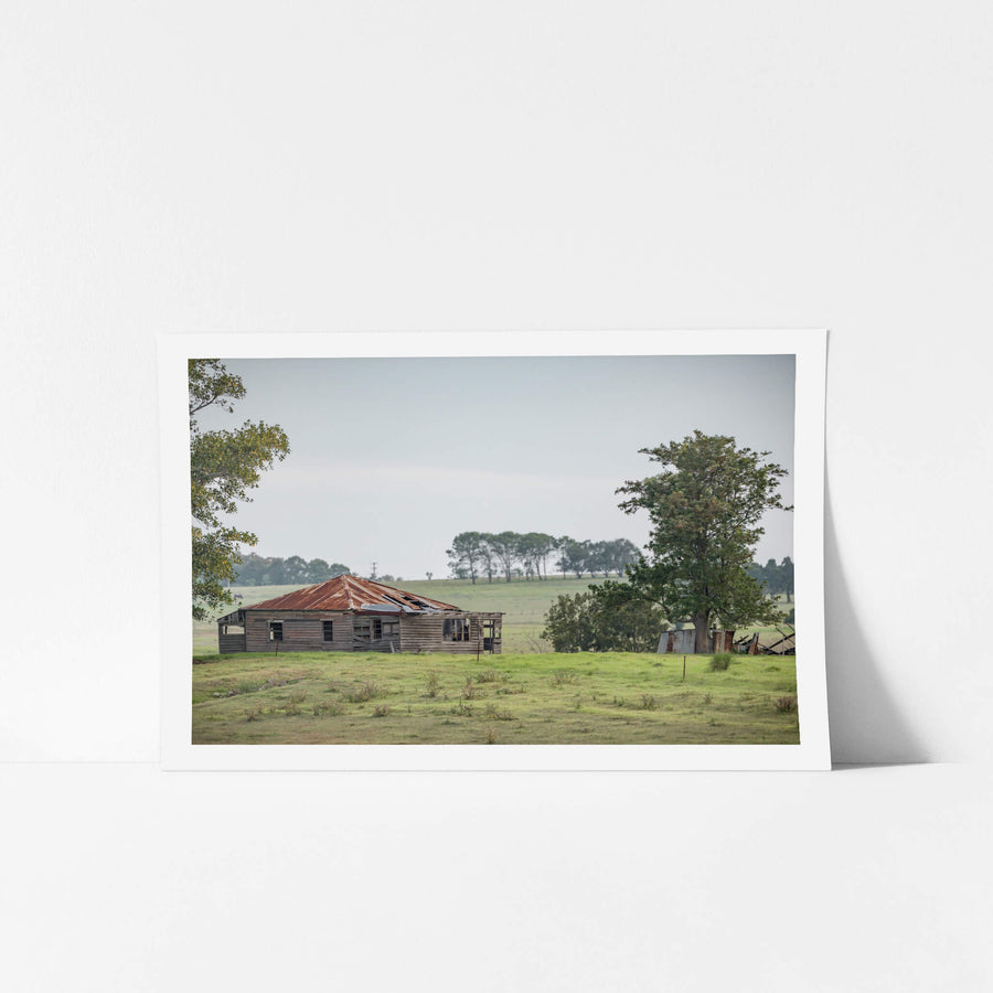 Hunter Homestead at A Place to Call Home, a weatherboard farmhouse sits low in open paddock, its hip roof a patchwork.