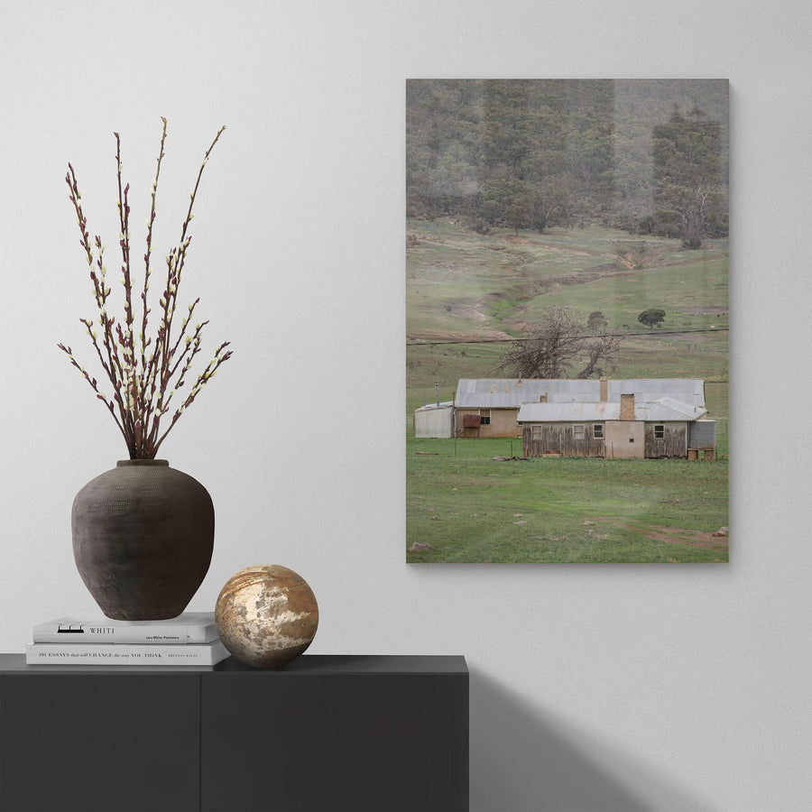 Valley Shearers Quarters at A Place to Call Home, a corrugated iron roof sits low over rendered walls and weathered timber.