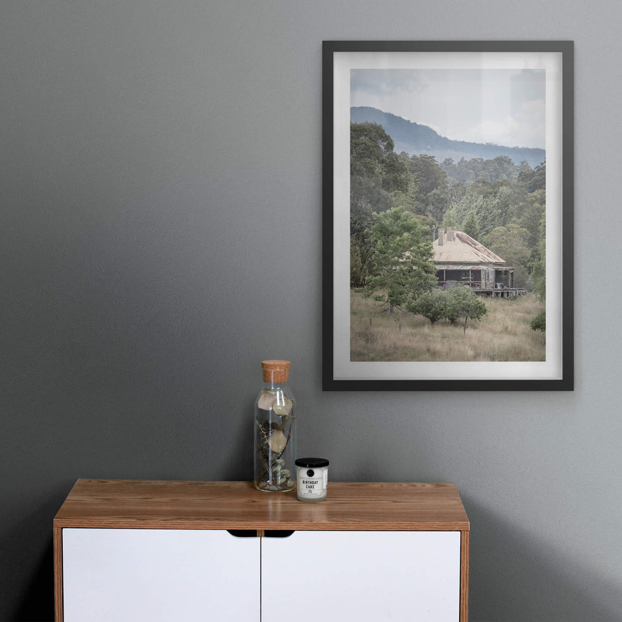 Wyndam Home at A Place to Call Home, a weatherboard homestead sits low in dry grass, its hipped roof a patchwork of rust.