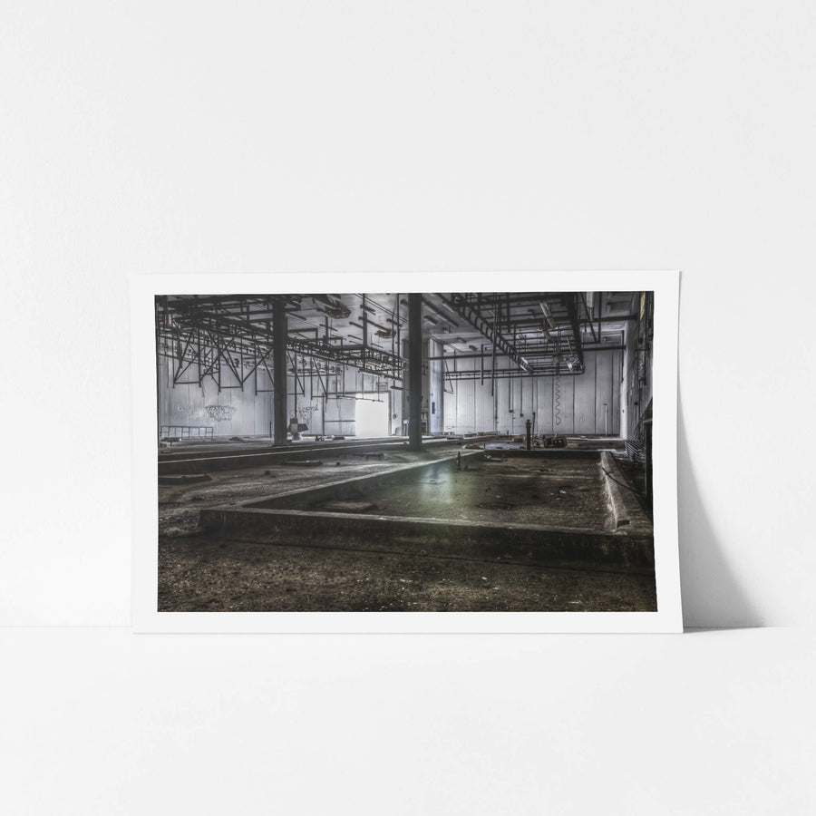 Kill Floor at Blayney Abattoir, steel columns rise from a concrete floor divided into shallow bays and drainage channels.
