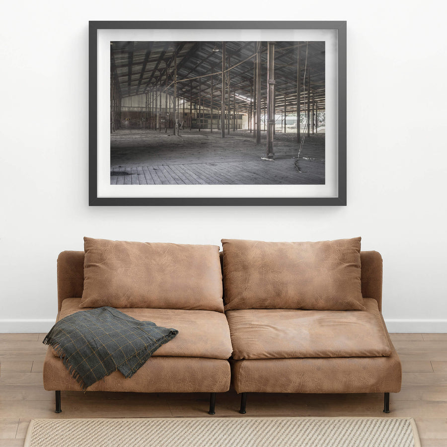 Skin Shed at Blayney Abattoir, steel columns run in rows across a wide timber floor, supporting a corrugated iron roof held.