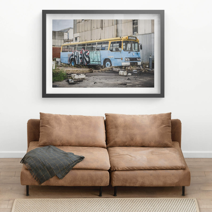 Bus at Bradmill Denim, a decommissioned bus sits against corrugated steel cladding in a yard at the Bradmill site.