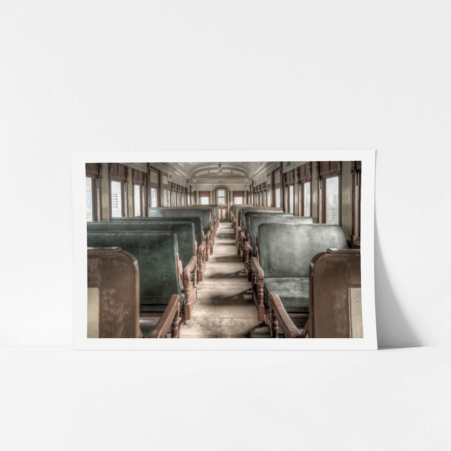 Centurion at Eveleigh Paint Shop, green leather seat backs line both sides of a narrow central aisle.