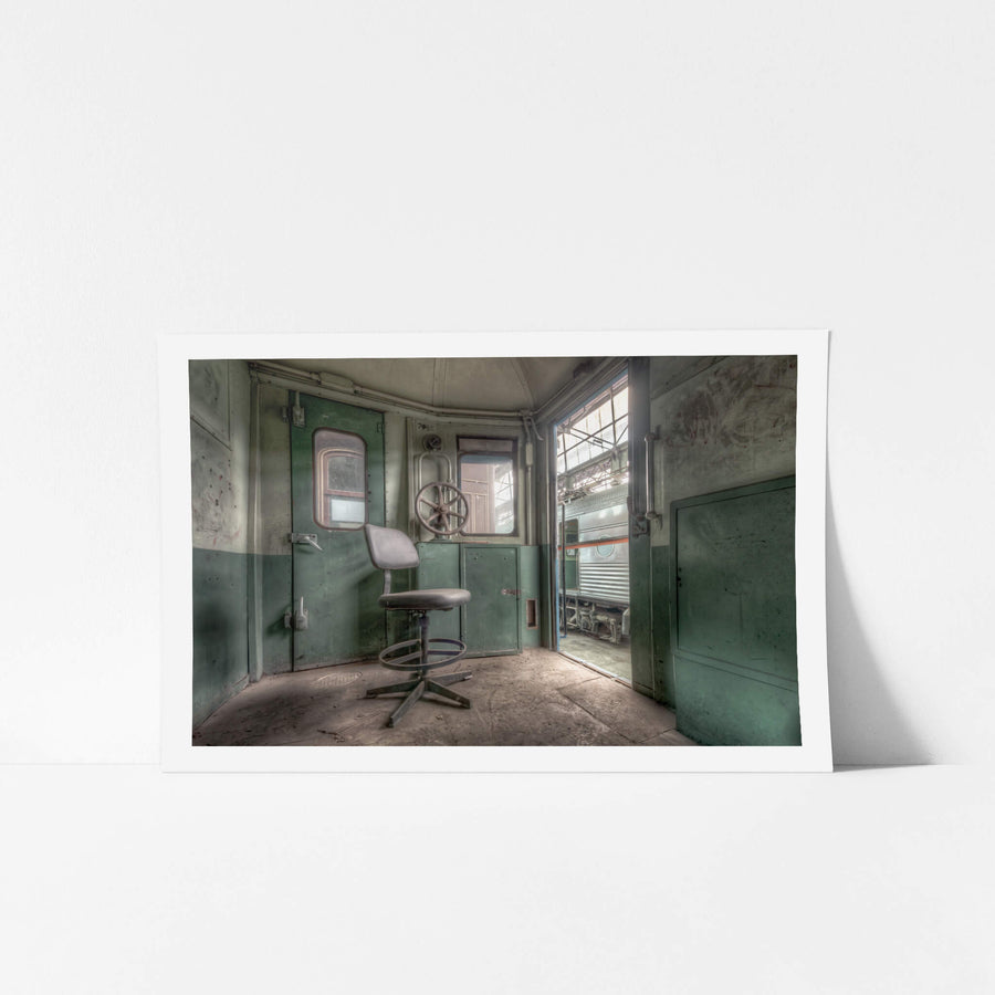 Guards Compartment at Eveleigh Paint Shop, a drafting chair sits on the gritty floor of the guard's compartment inside car C7485.