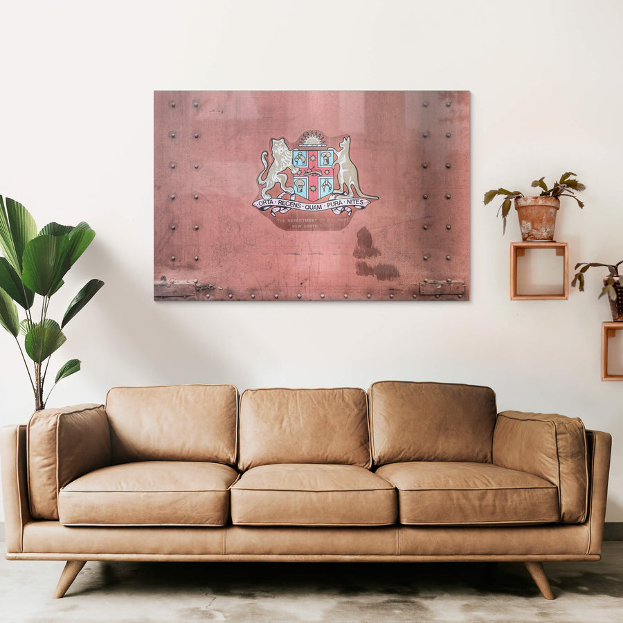 NSW State Emblem at Eveleigh Paint Shop, the New South Wales coat of arms sits centre on a riveted steel panel.