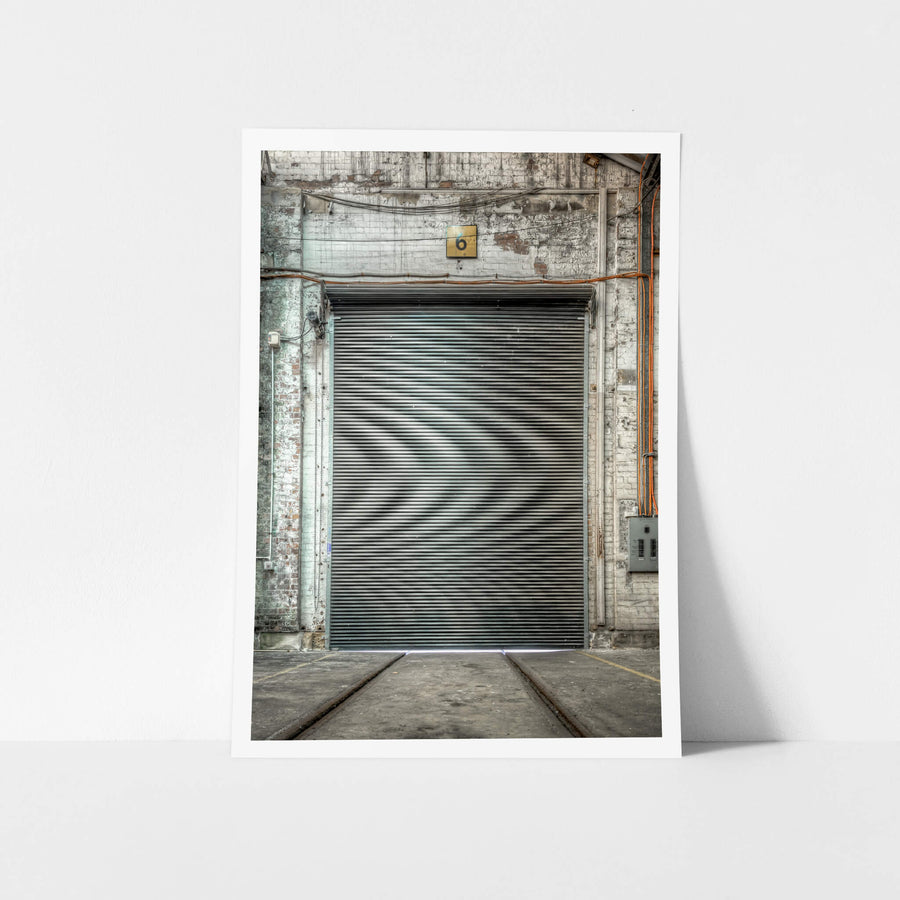 Roller Door at Eveleigh Paint Shop, a corrugated roller door fills the frame inside the Eveleigh Paint Shop.