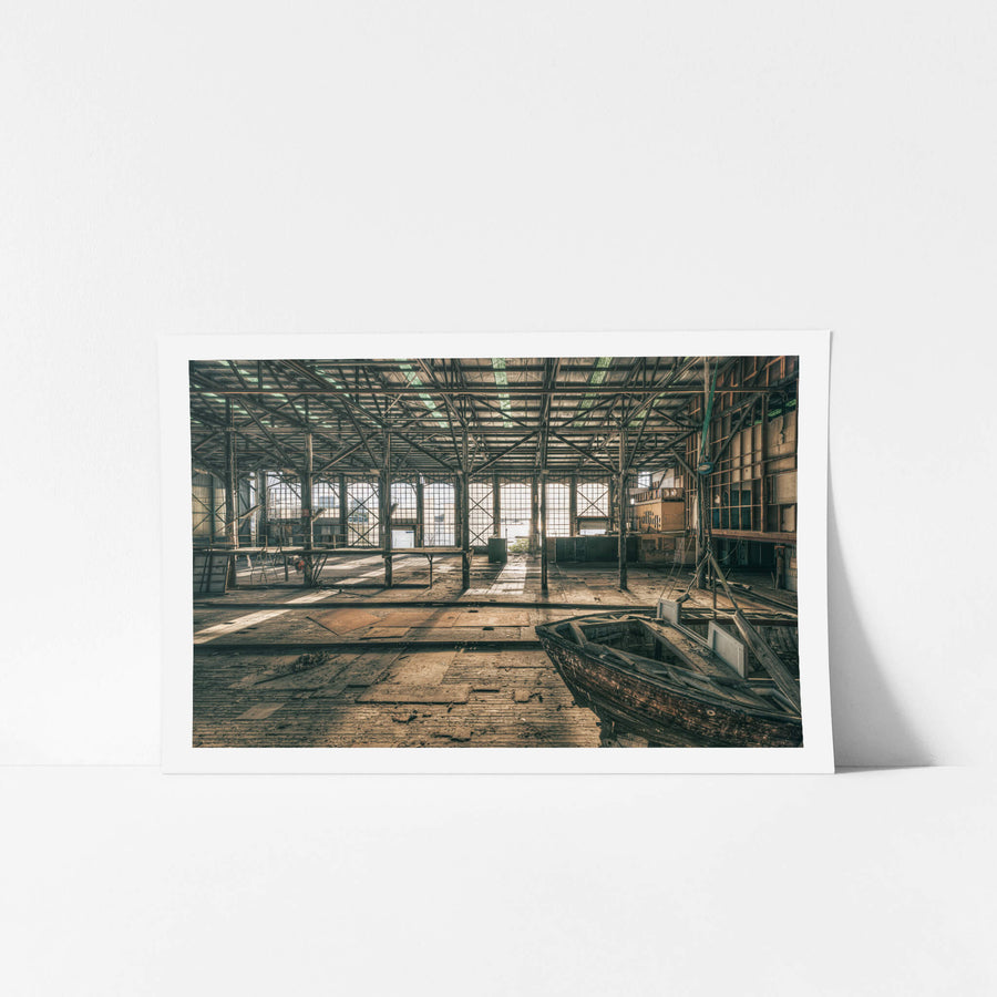 Deck at Halvorsens Boat Yard, steel columns rise from a worn timber deck inside a vast industrial shed.