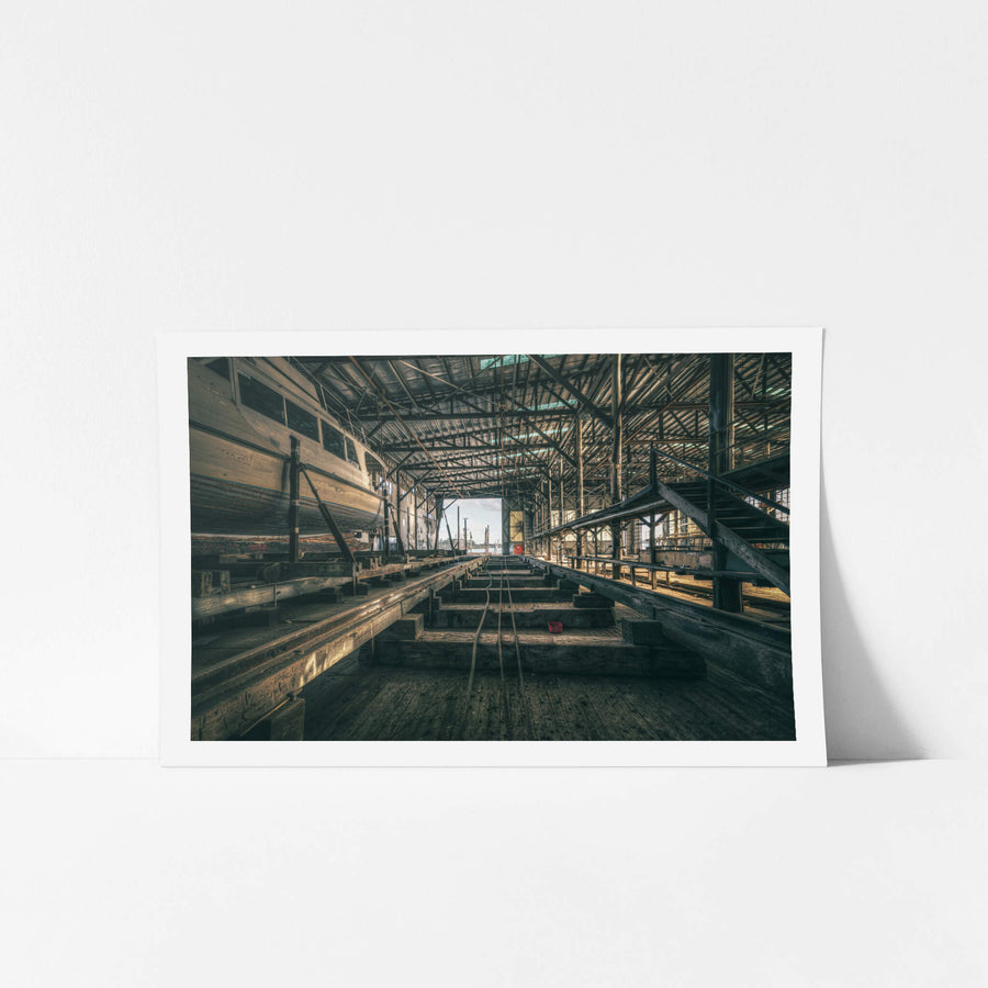 Sleeper Row at Halvorsens Boat Yard, heavy timber sleepers run in parallel lines down the centre of the shed, steel cables.