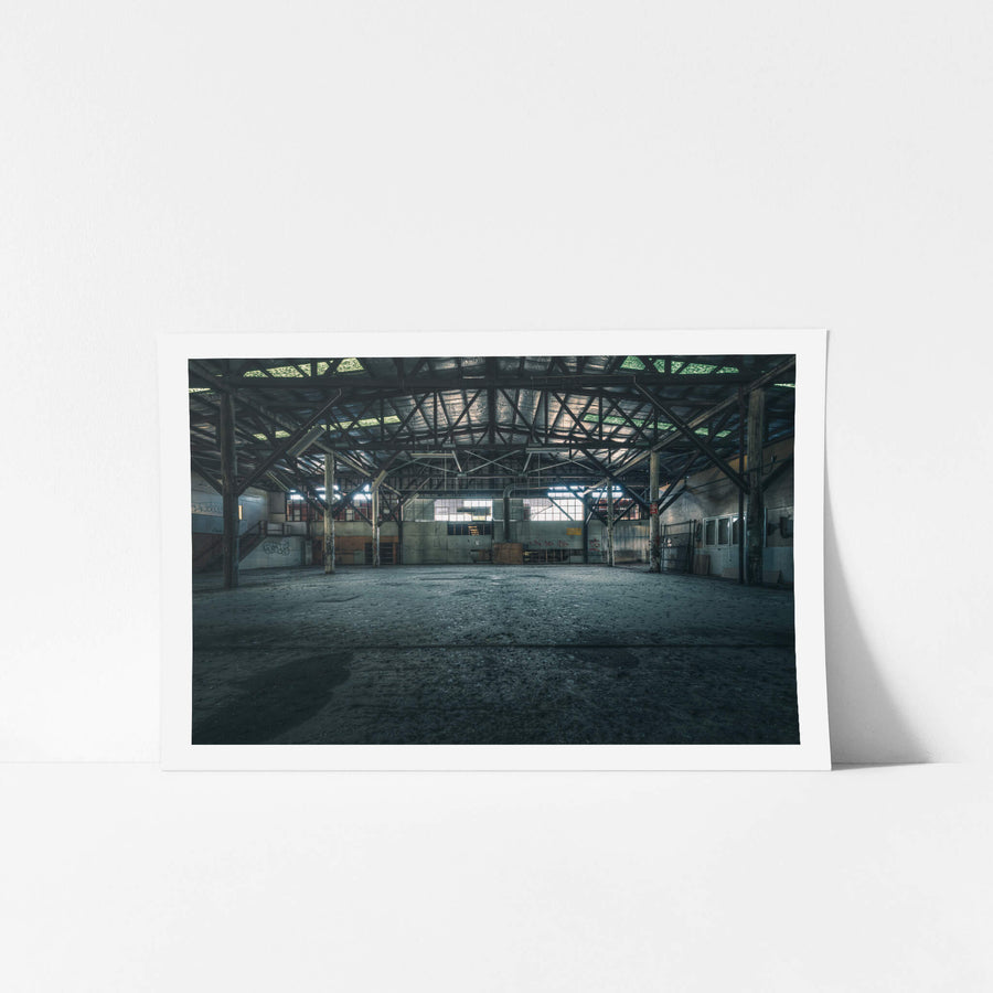 Warehouse at Halvorsens Boat Yard, steel trusses span the full width of the warehouse, supported by heavy timber columns.