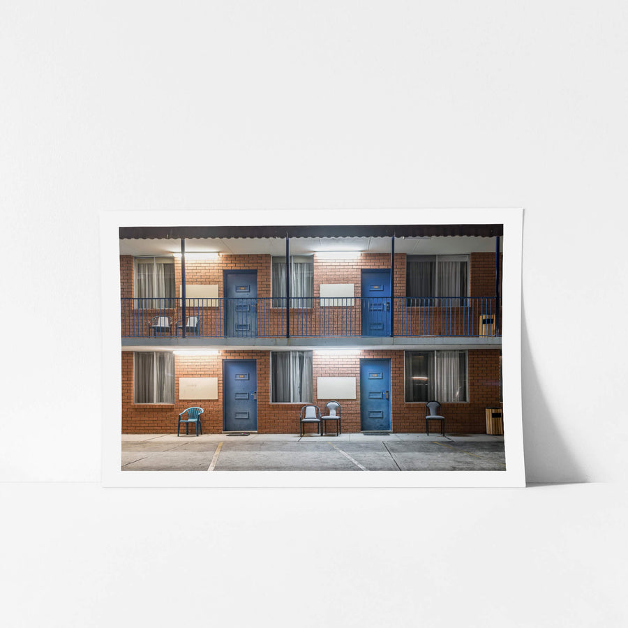 Ashfield Motor Inn at Hotel Motel 101, two storeys of brown brick and blue steel.