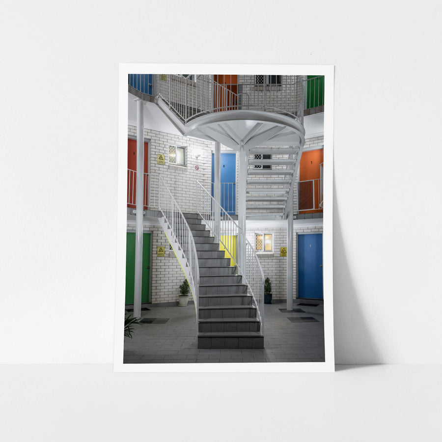 Beach Park Motel, Wollongong at Hotel Motel 101, colourful doors in a white brick motel stairwell.
