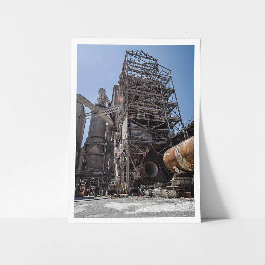 Preheater Building at Kandos Cement Works, a lattice of steel framing rises several storeys against open sky, its cladding.