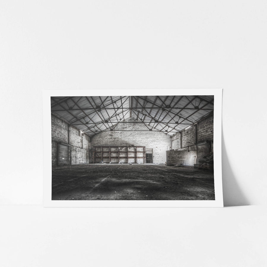 Store Building at Kandos Cement Works, steel trusses span the full width of the building, bolted to thick limestone block.