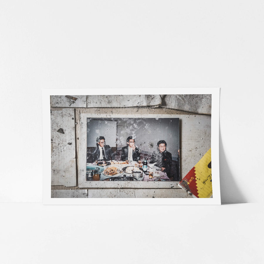 Doctors Dinner at Kuwashima Hospital, a colour photograph lies on stained tile flooring.