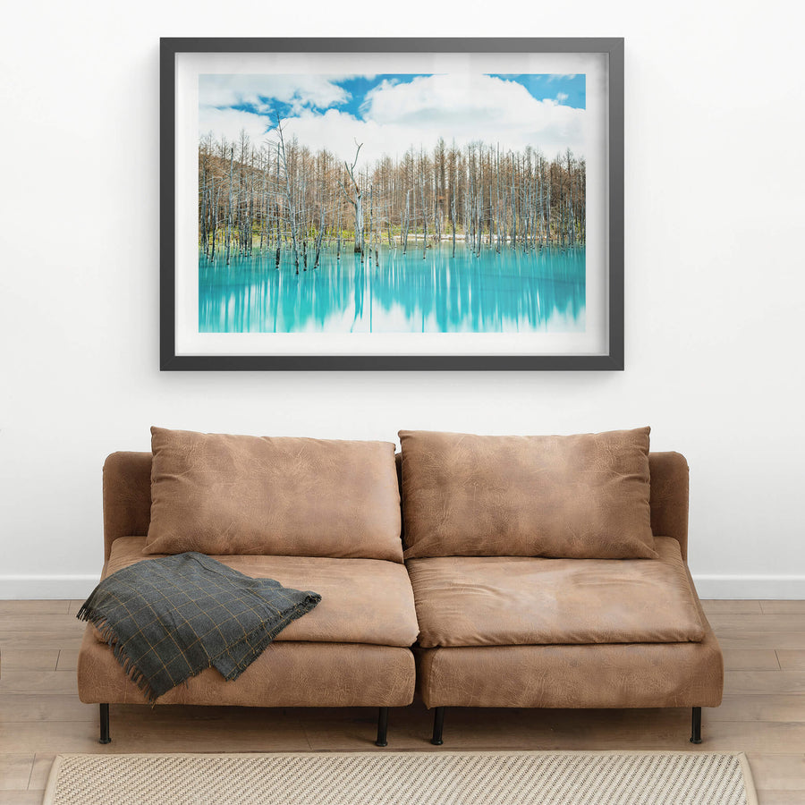 Aoiike at Landscapes, dead birch and larch stand upright in opaque turquoise water.