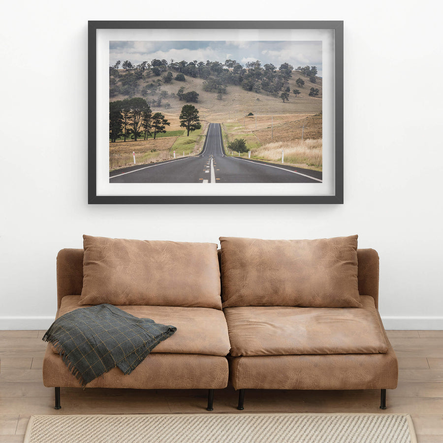 Monaro Highway at Landscapes, a road that rises and falls with the land, carving a path through the rolling hills.