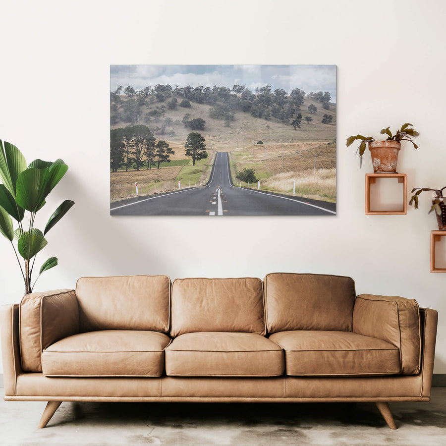 Monaro Highway at Landscapes, a road that rises and falls with the land, carving a path through the rolling hills.
