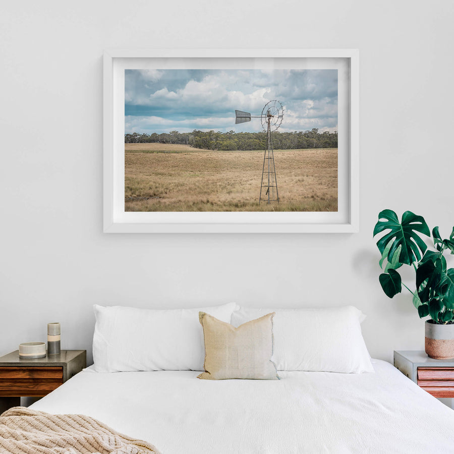 Snowy Mountains Windmill at Landscapes, a lone windmill in a paddock on a cloudy afternoon.
