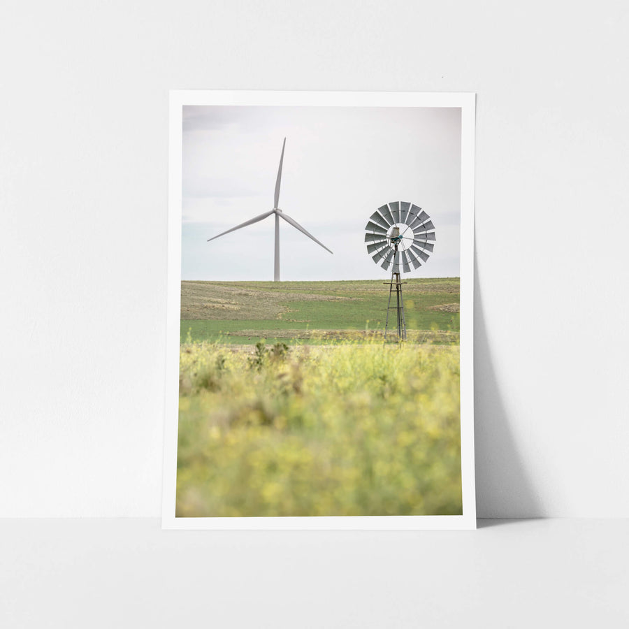 What Came Before at Landscapes, a galvanised multi-blade windmill stands on a steel lattice tower in the foreground.