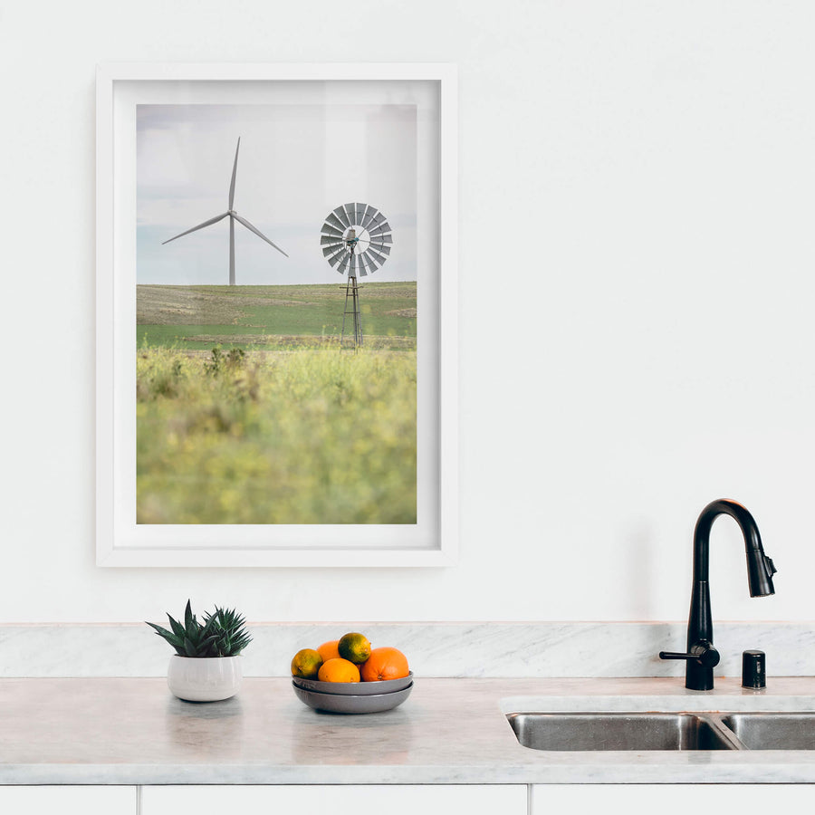 What Came Before at Landscapes, a galvanised multi-blade windmill stands on a steel lattice tower in the foreground.