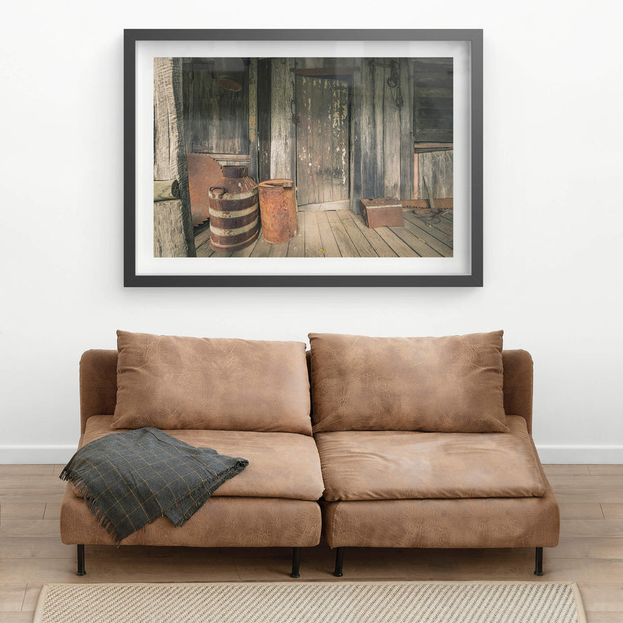 Porch at Leichhardt House, a covered timber verandah, grey and split with age.