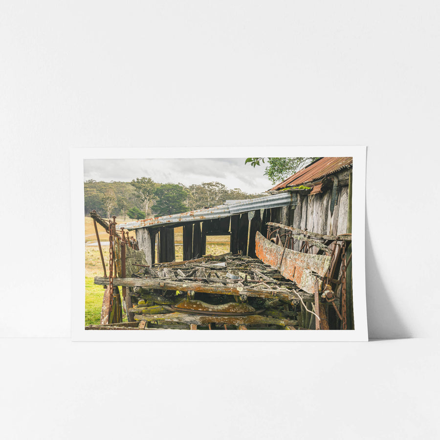 Wagon Tray at Leichhardt House, a horse-drawn wagon sits collapsed beside a slab timber shed.