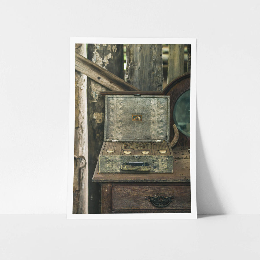 Wireless Front On at Leichhardt House, a portable valve radio sits open on a timber dresser, its lid propped back to reveal.