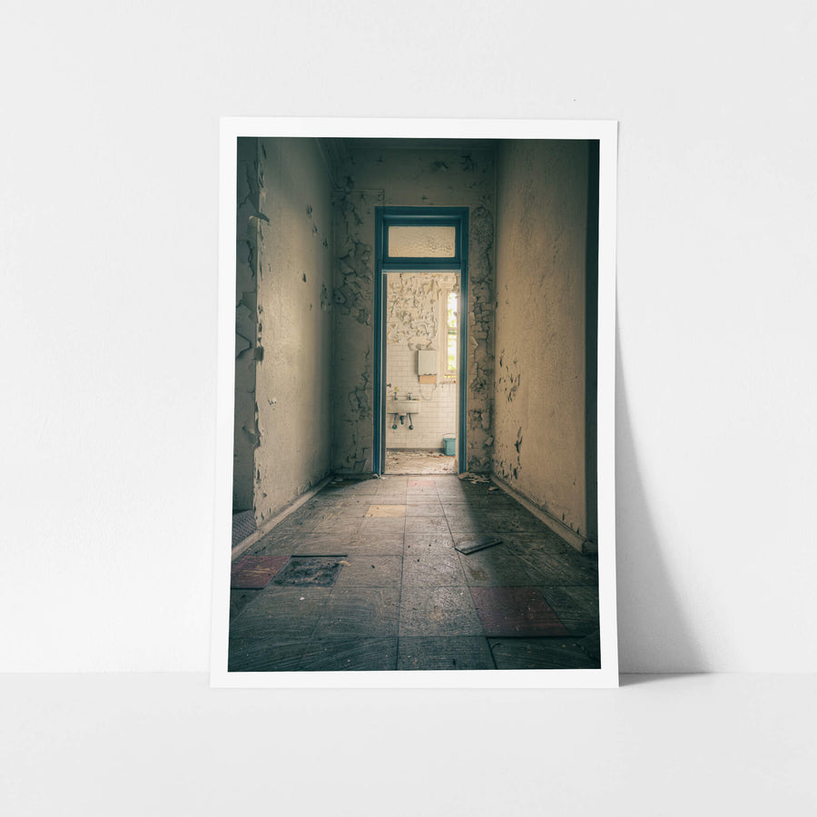 Bathroom Corridor at Lewisham Hospital, a narrow corridor leads to a small bathroom.