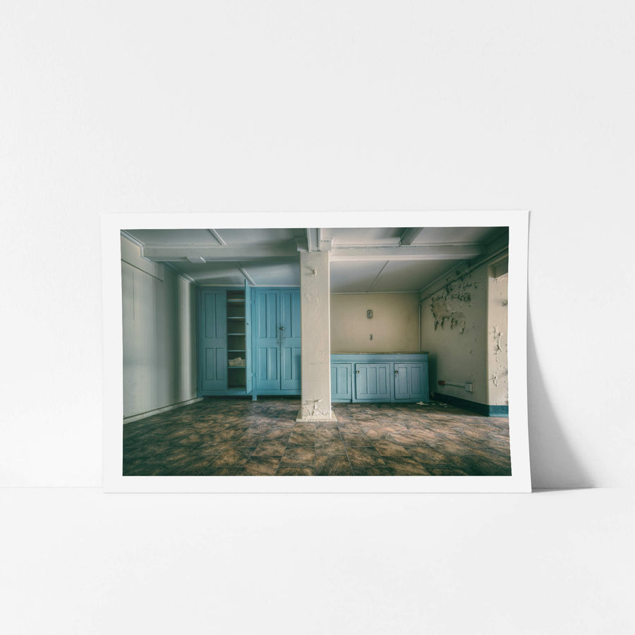 Nurses Lunch Room at Lewisham Hospital, blue panelled cabinetry lines two walls of a basement-level room.