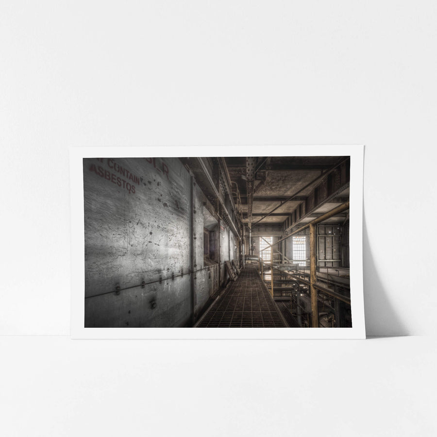 Boiler House at Morwell Power Station, a steel mesh walkway runs between concrete-clad boiler casings and a lattice of pipes.