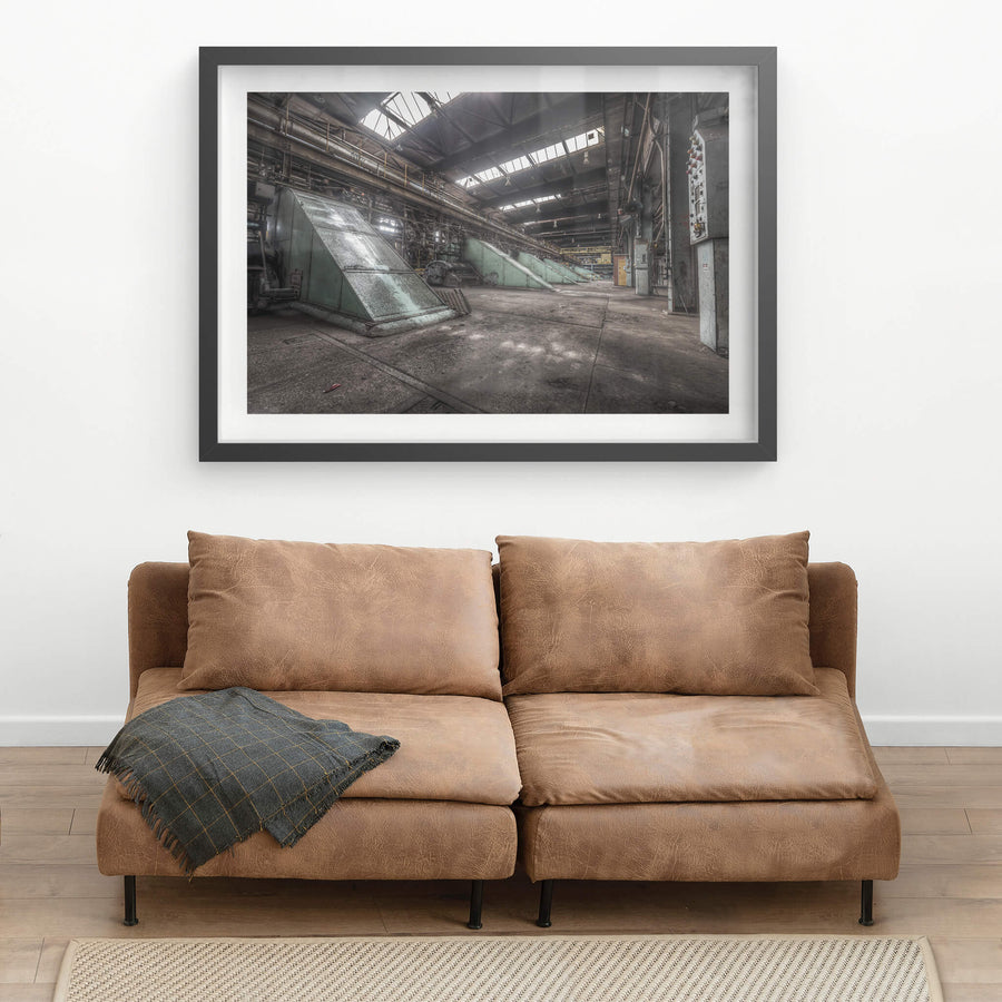 Main Press Floor at Morwell Power Station, large green steel housings sit at sharp angles along the concrete floor.