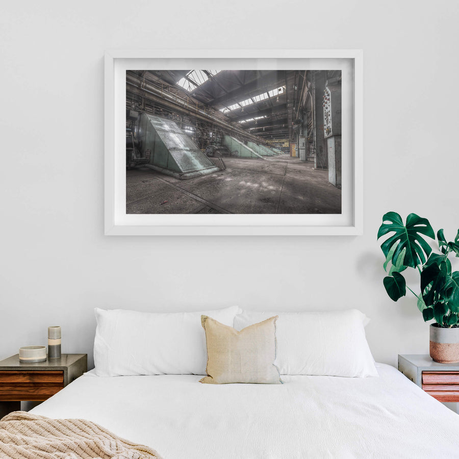Main Press Floor at Morwell Power Station, large green steel housings sit at sharp angles along the concrete floor.