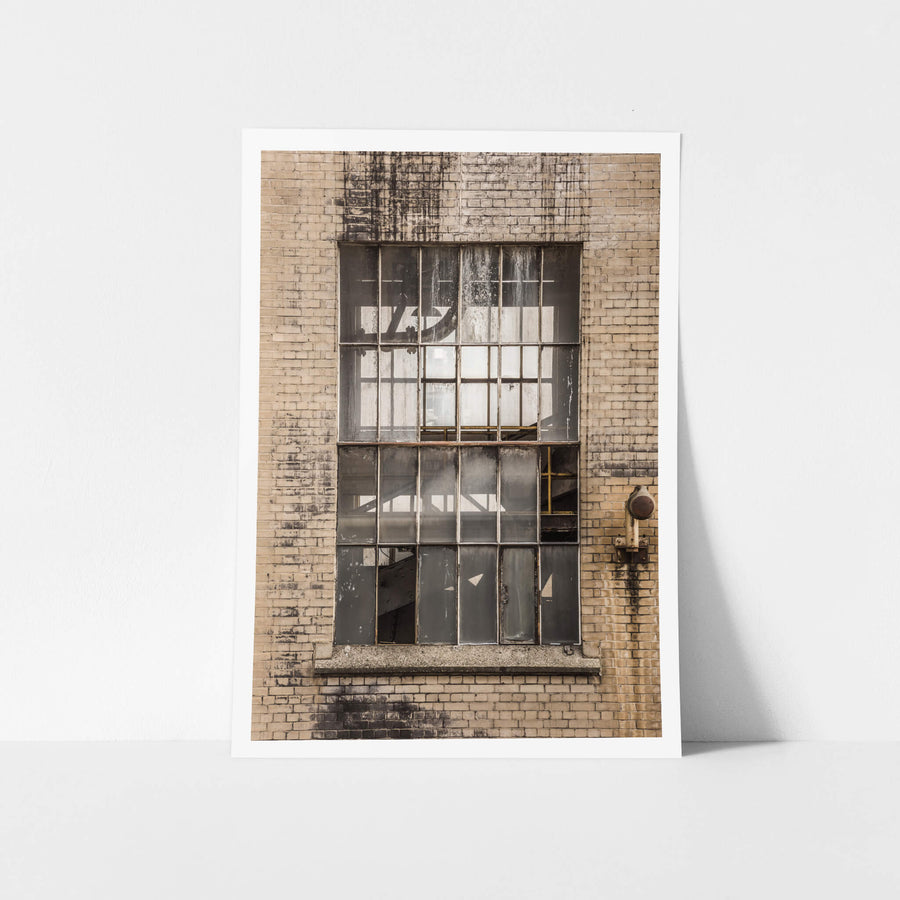 Transfer House at Morwell Power Station, cream brick facade, blackened where water has tracked down from the roofline.