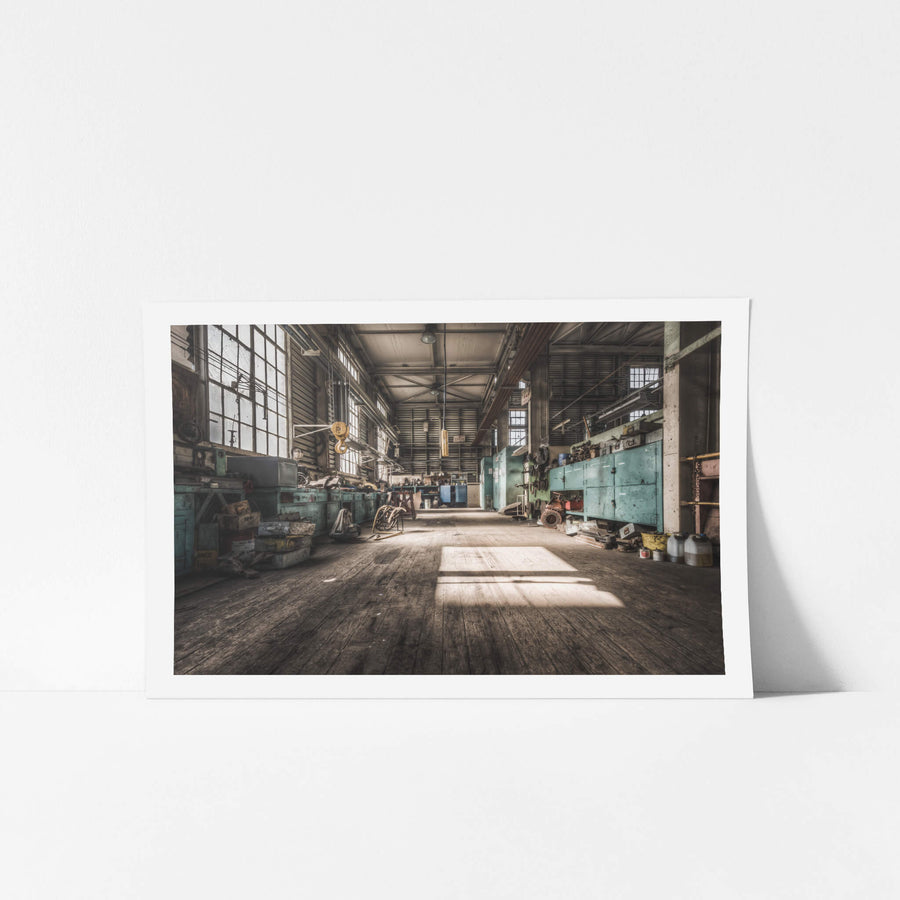 Workshop at Morwell Power Station, a rectangle of sunlight falls across worn timber floorboards inside the maintenance.
