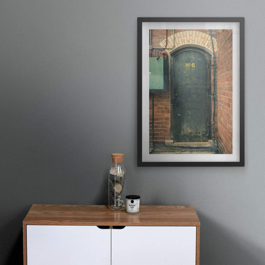 Magazine Door 6 at Newington Armory, a heavy steel door sits recessed into red brick.
