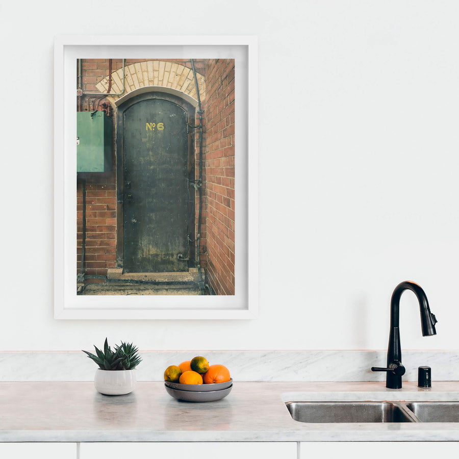 Magazine Door 6 at Newington Armory, a heavy steel door sits recessed into red brick.