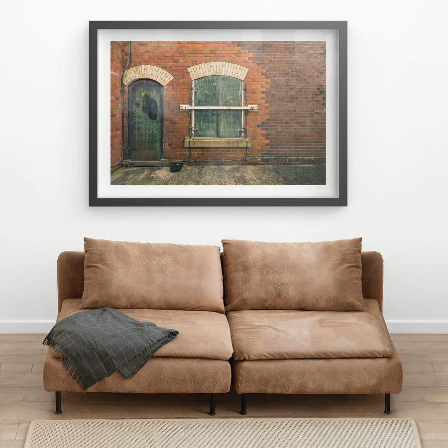 Magazine Hatch at Newington Armory, red brick facade, two arched openings side by side.