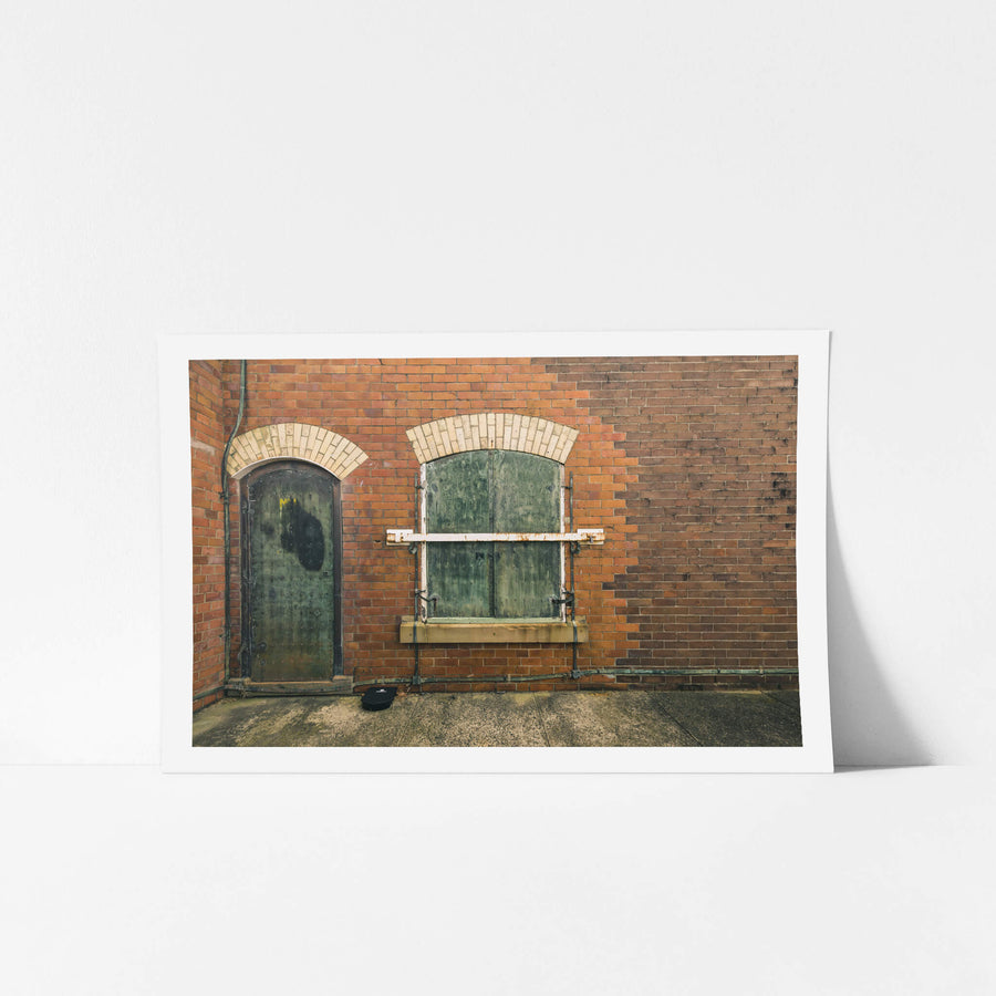 Magazine Hatch at Newington Armory, red brick facade, two arched openings side by side.
