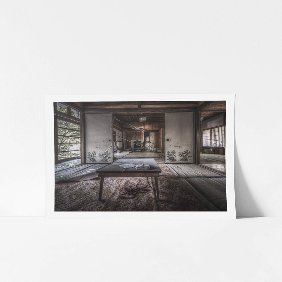 Dining Table at Nichitsu Mining Village, a low wooden chabudai sits at the centre of a tatami room, dust thick.