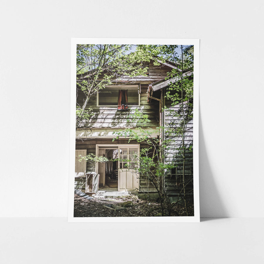 Entrance at Nichitsu Mining Village, the timber weatherboard facade of a communal building.