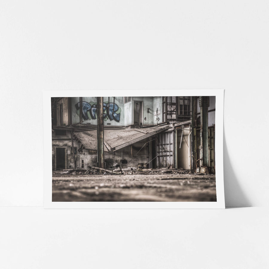 Loading Dock at O-I Glass, a collapsed awning sags at a steep angle across the loading dock, its sheeting buckled and grey.