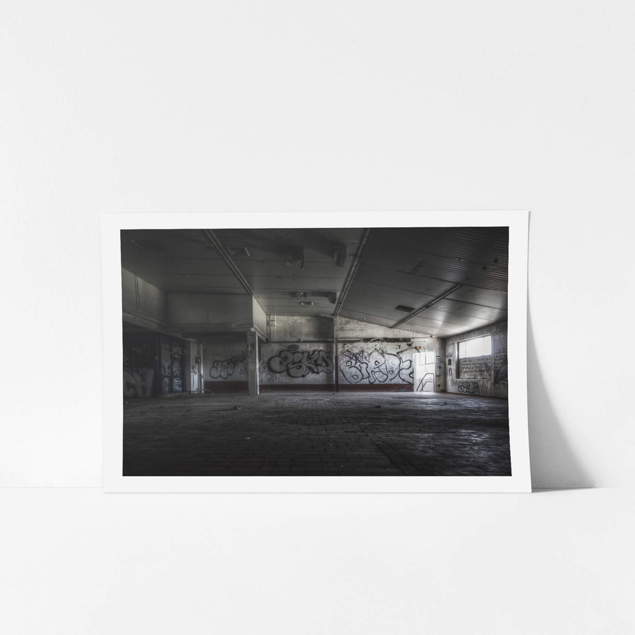 Production Packaging Room at Peters Ice Cream Factory, a wide commercial floor stretches out under a low corrugated metal ceiling.