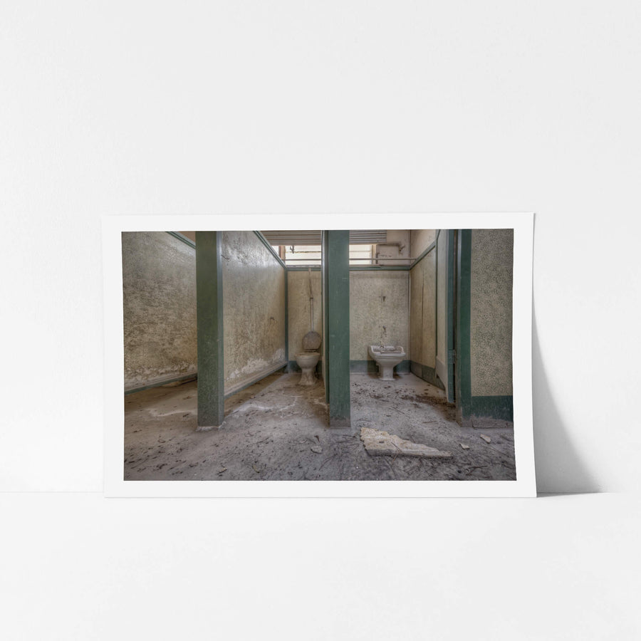 Annex Toilet at Portland Cement Works, green-painted timber partitions divide a row of cubicles in the annex block.