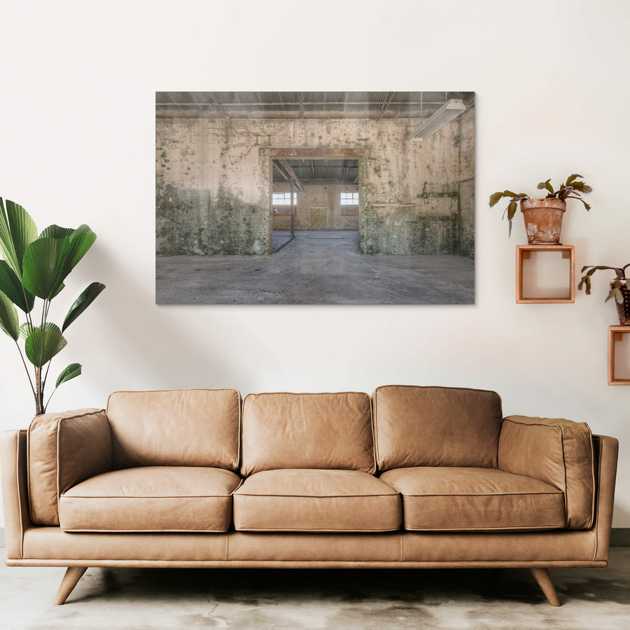 Blacksmith To Electrical Workshops at Portland Cement Works, a wide doorway cuts through a thick brick wall, connecting two.