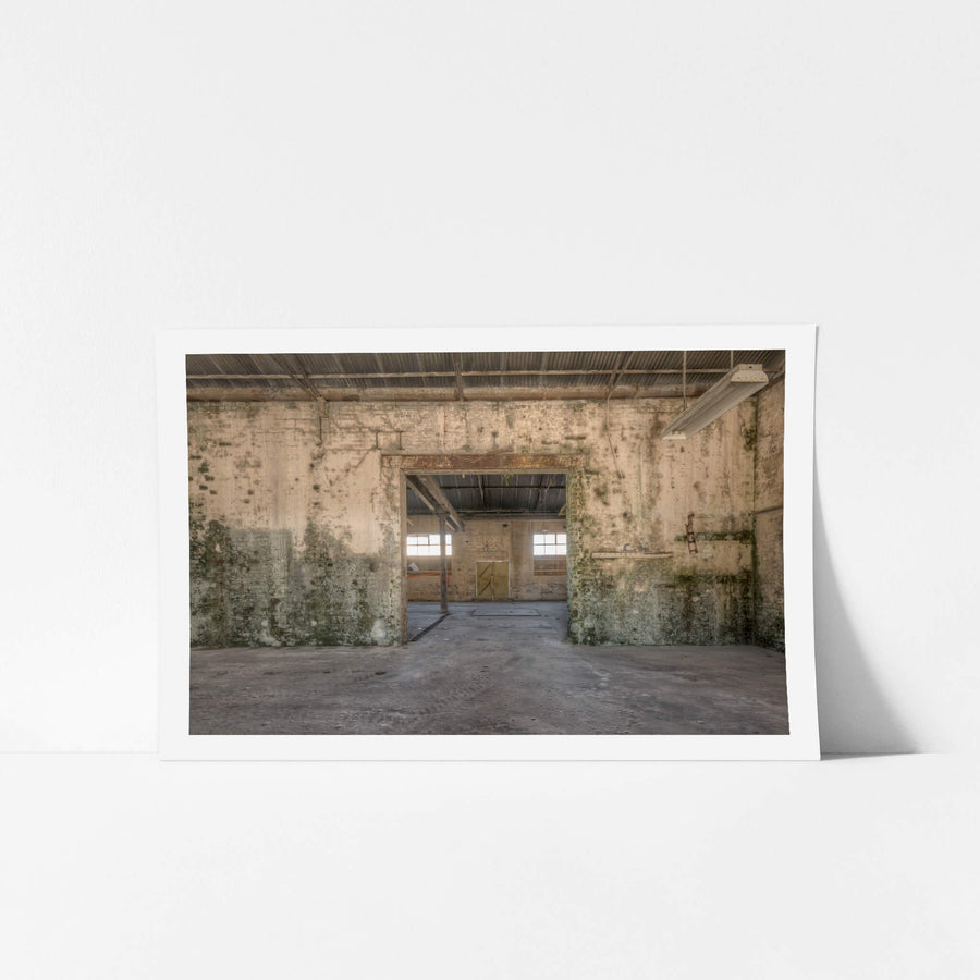 Blacksmith To Electrical Workshops at Portland Cement Works, a wide doorway cuts through a thick brick wall, connecting two.